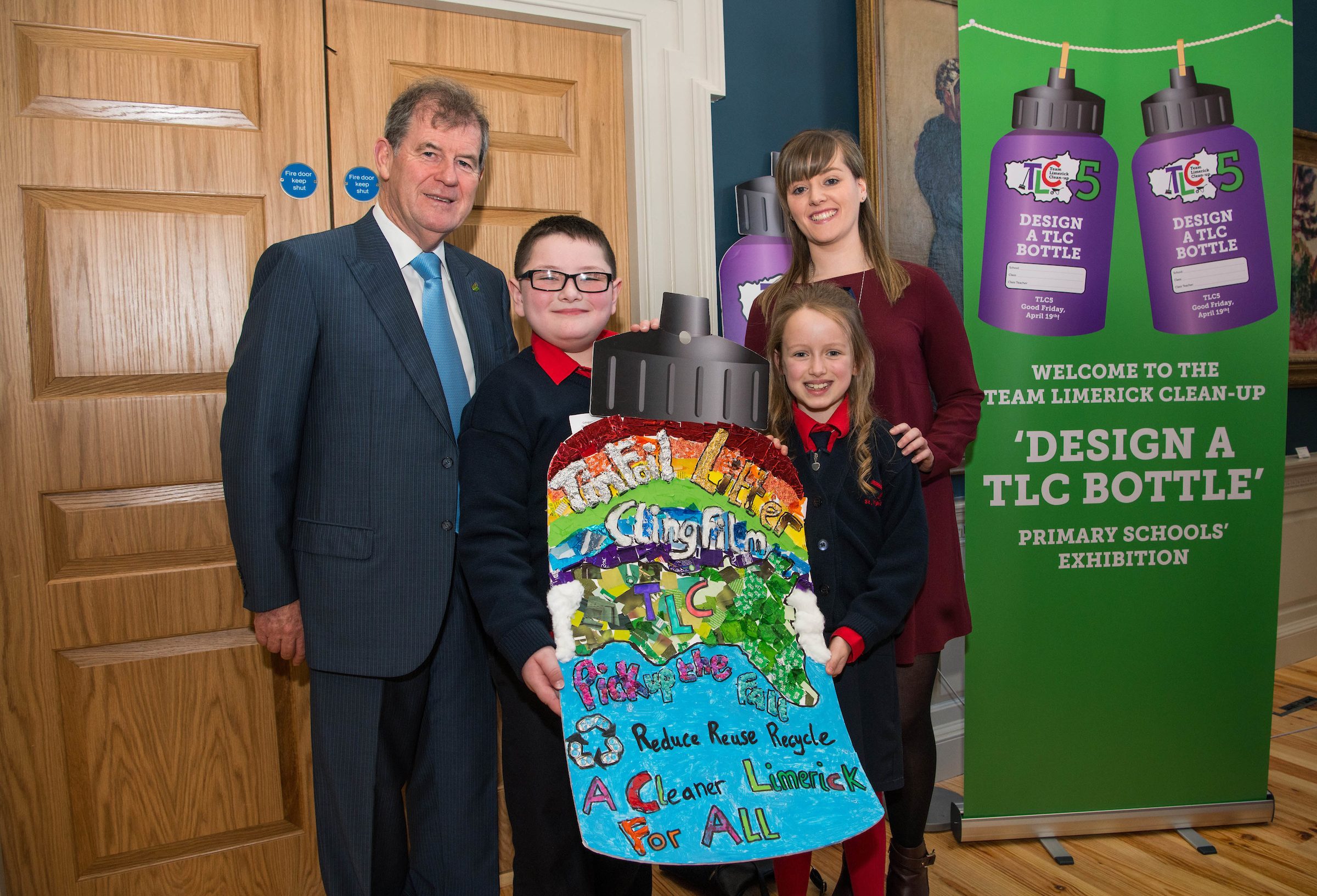 07/03/20193rd place winners of the 3rd and 4th class category are 3rd class students MJ O'Neill and Hazel Brassil from St Brigid's NS along with teacher Emma O'Connor and JP McManus at the 'Design a TLC Bottle' prizegiving at the Hunt Museum, Limerick. Over 50 primary schools across the county entered ahead of Team Limerick Clean-Up 5, which will see thousands of volunteers take to the streets of Limerick city and county for Europe's largest one-day clean up. Sponsored by the JP McManus Benevolent Fund, the event has seen over 360 tonnes of litter gathered from the streets since inception in 2015. Over 14,000 volunteers have already signed up for the 2019 event, taking place on Good Friday, 19th April. Photo by Diarmuid Greene