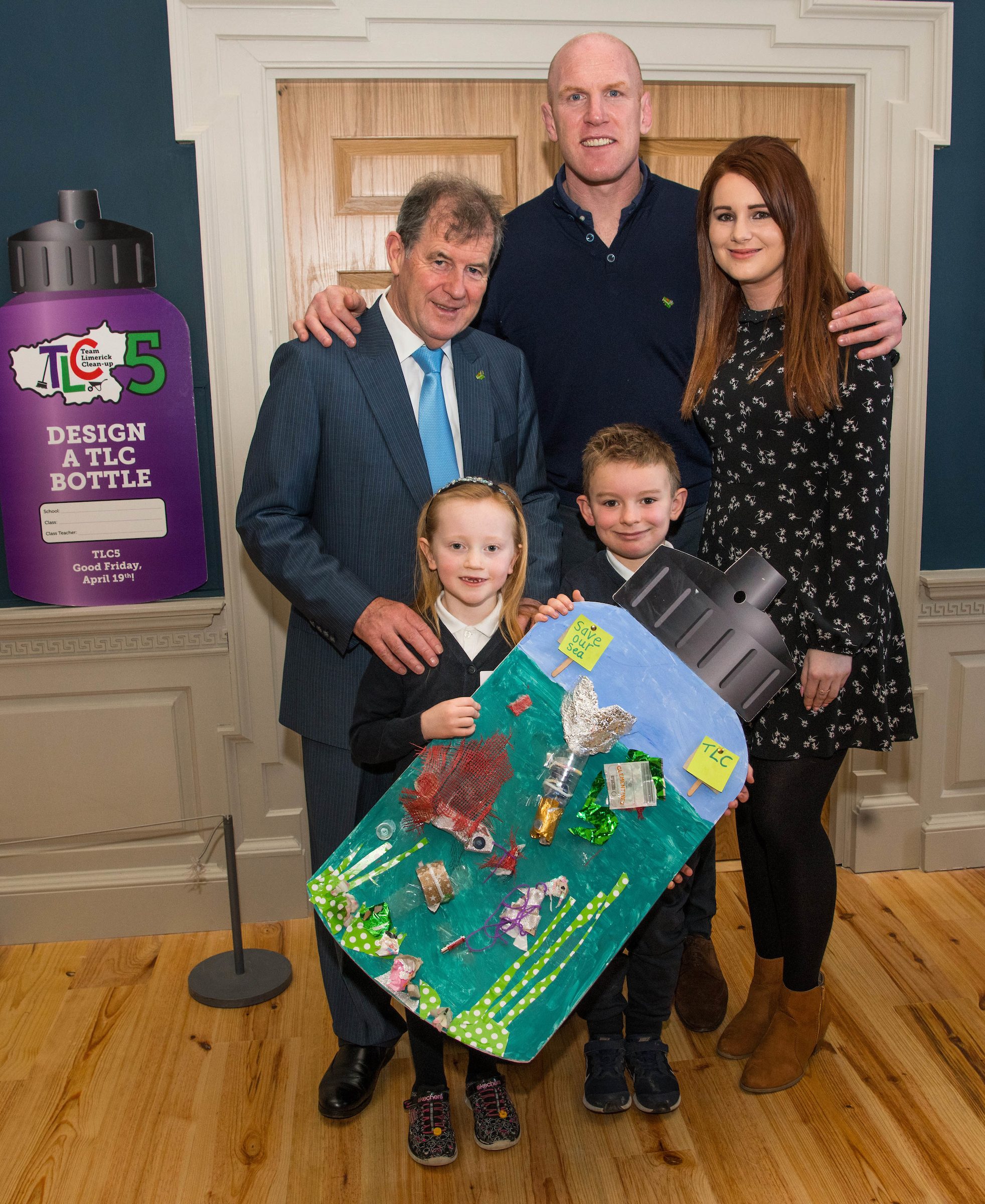 07/03/20192nd place winners of the junior infants-2nd class category are students Carla O'Brien, senior infants, and Eli O'Sullvian, 1st class, from Bulgaden NS along with teacher Charlotte Reidy, JP McManus and Paul O'Connell at the 'Design a TLC Bottle' prizegiving at the Hunt Museum, Limerick. Over 50 primary schools across the county entered ahead of Team Limerick Clean-Up 5, which will see thousands of volunteers take to the streets of Limerick city and county for Europe's largest one-day clean up. Sponsored by the JP McManus Benevolent Fund, the event has seen over 360 tonnes of litter gathered from the streets since inception in 2015. Over 14,000 volunteers have already signed up for the 2019 event, taking place on Good Friday, 19th April. Photo by Diarmuid Greene